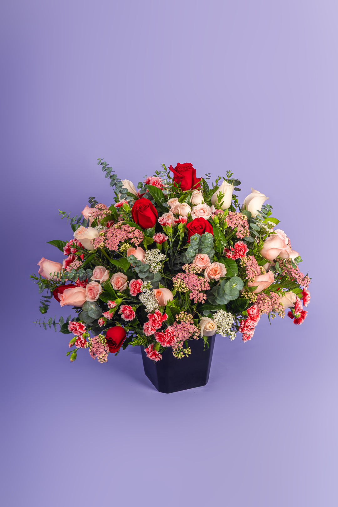 Box de rosas rosadas y rojas