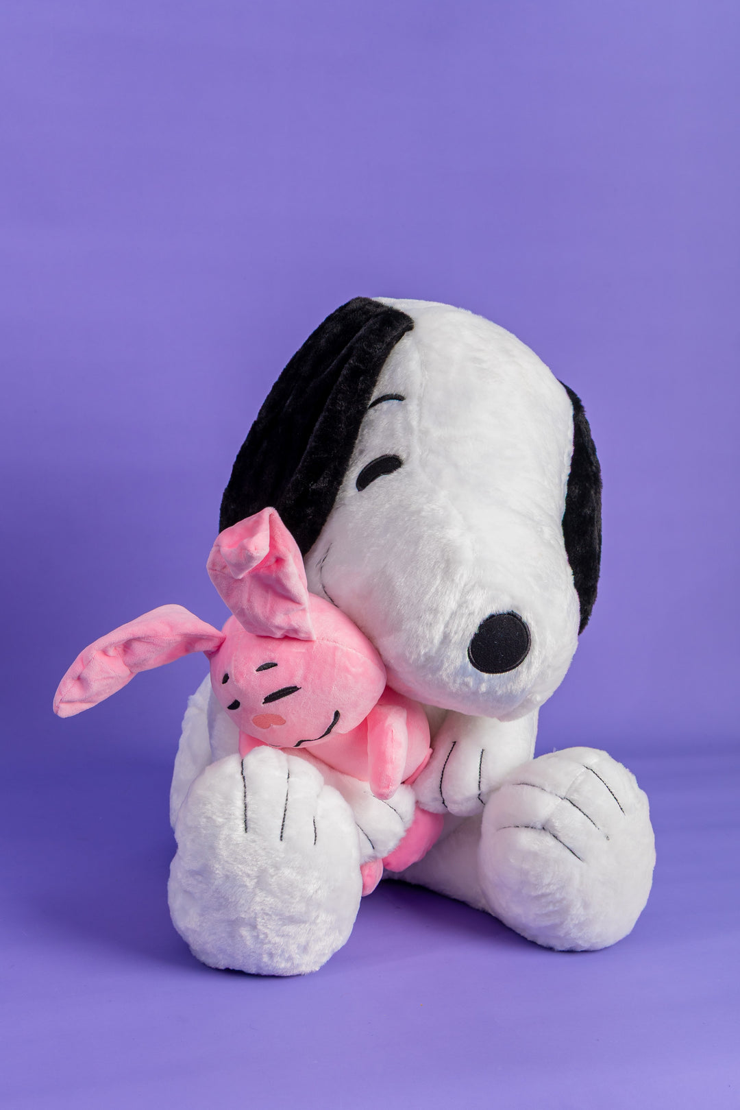 Snoppy con peluche rosado
