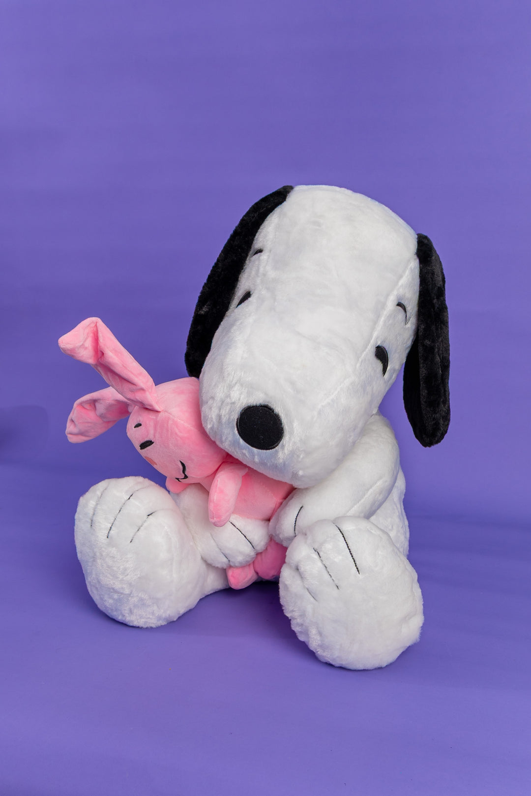 Snoppy con peluche rosado
