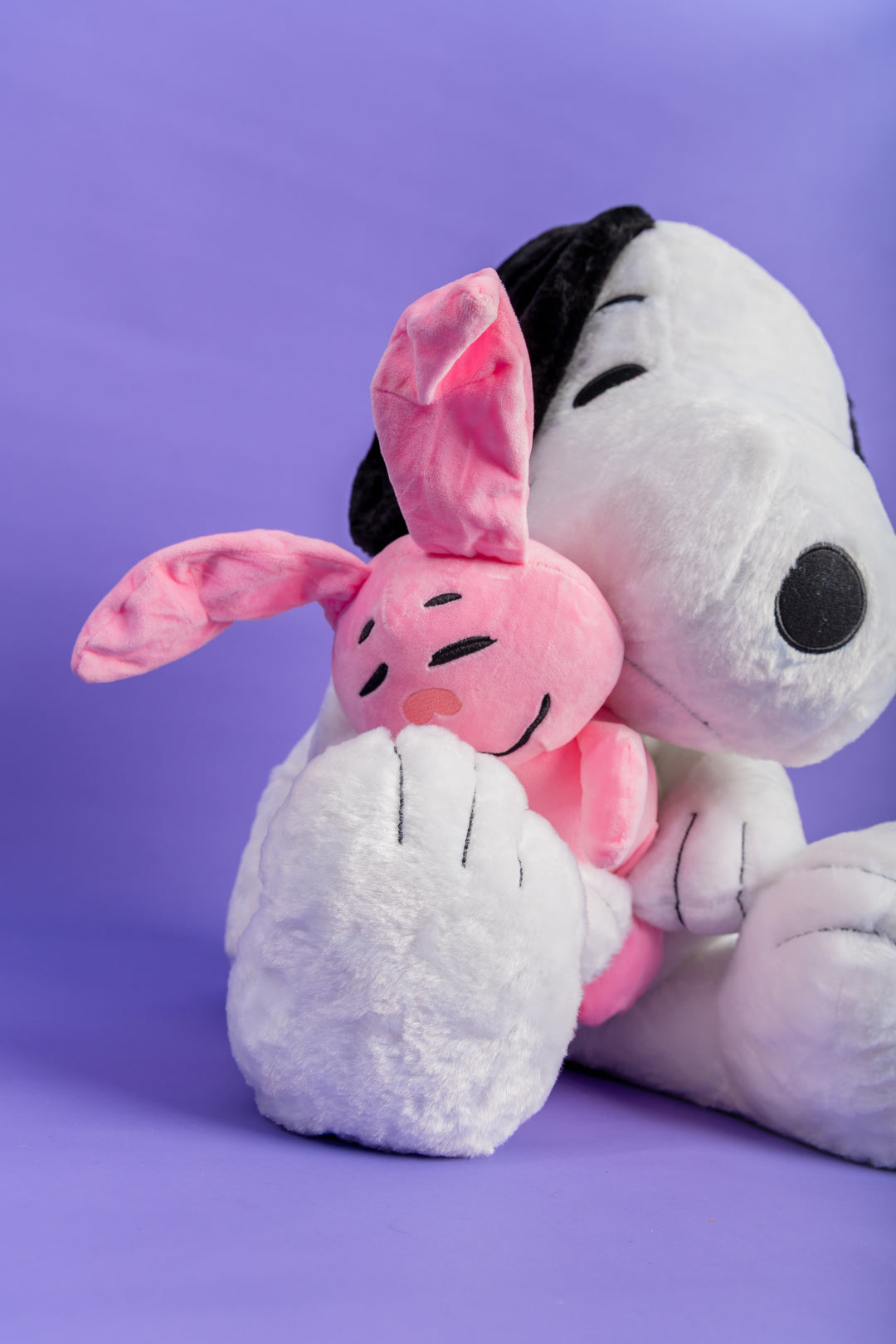 Snoppy con peluche rosado