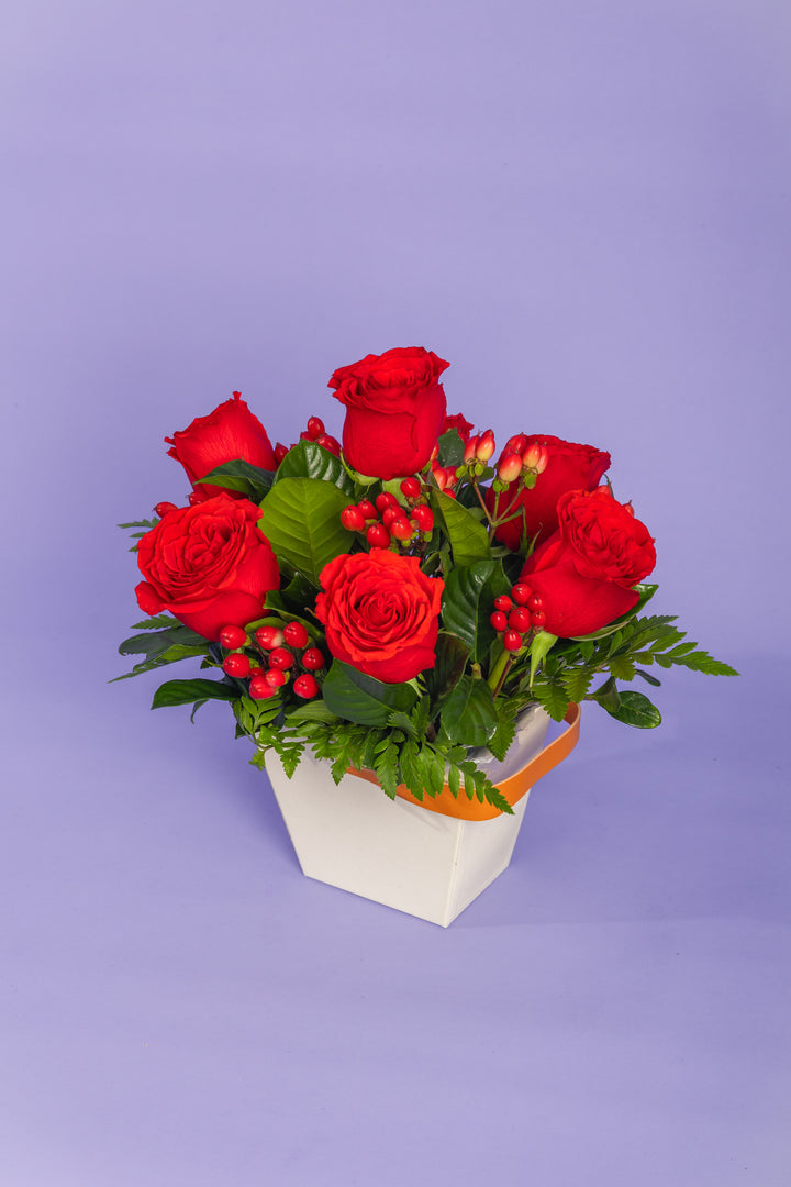 Mini box de 7 rosas rojas